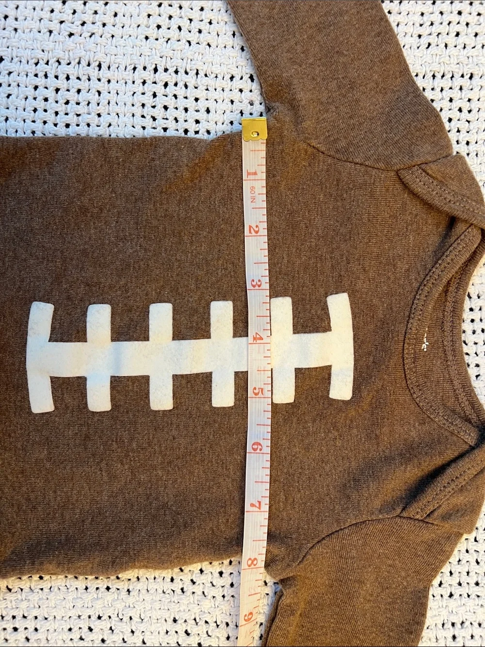 Carter’s | Brown Football-Stitch Long-Sleeve Baby One-Piece Size 3 Months